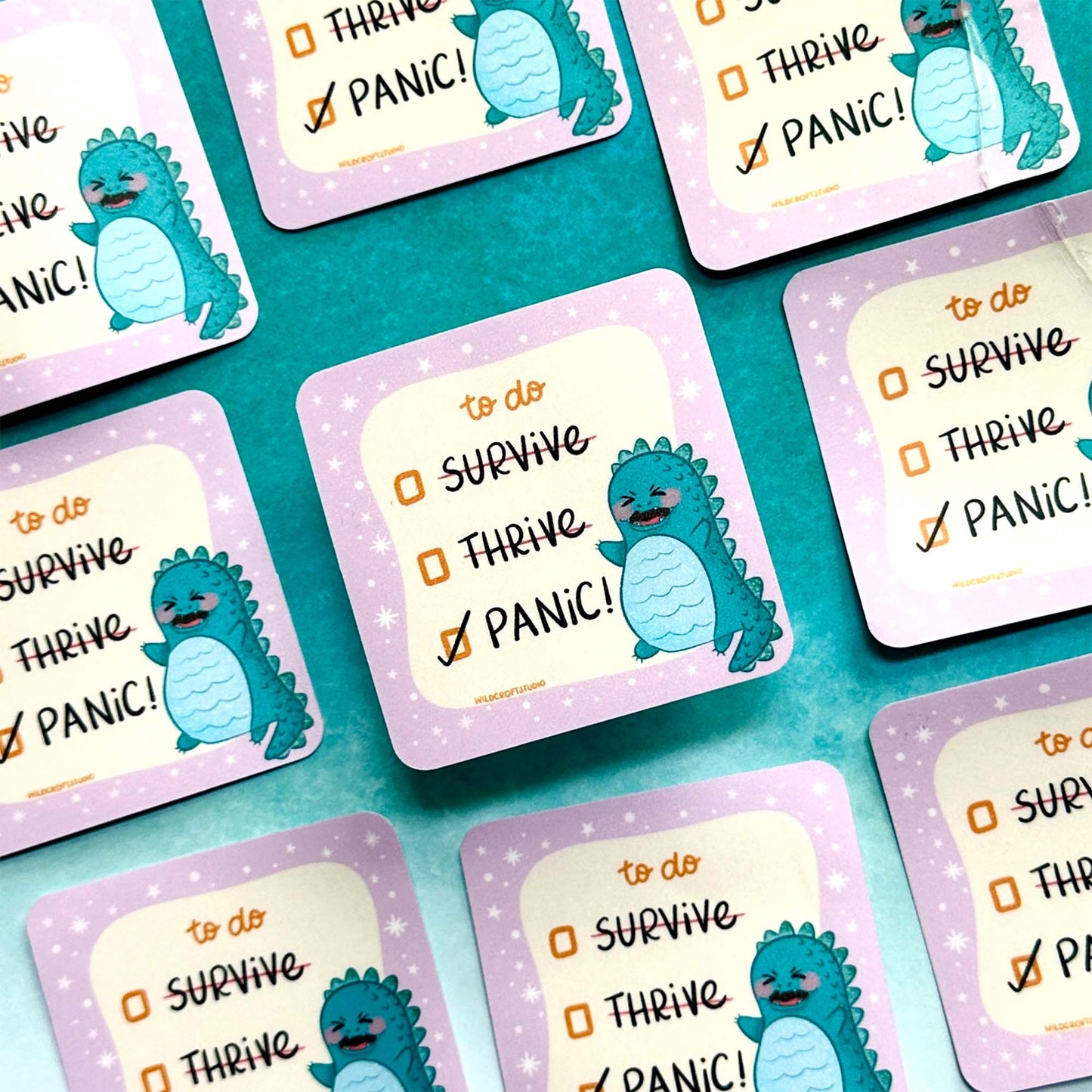 a table topped with lots of purple and blue coasters