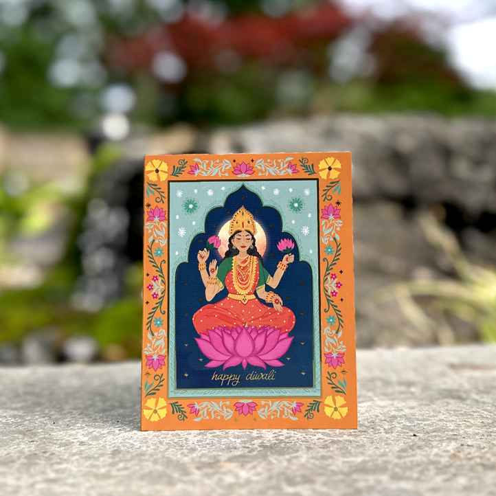 a small box with a picture of a buddha on it