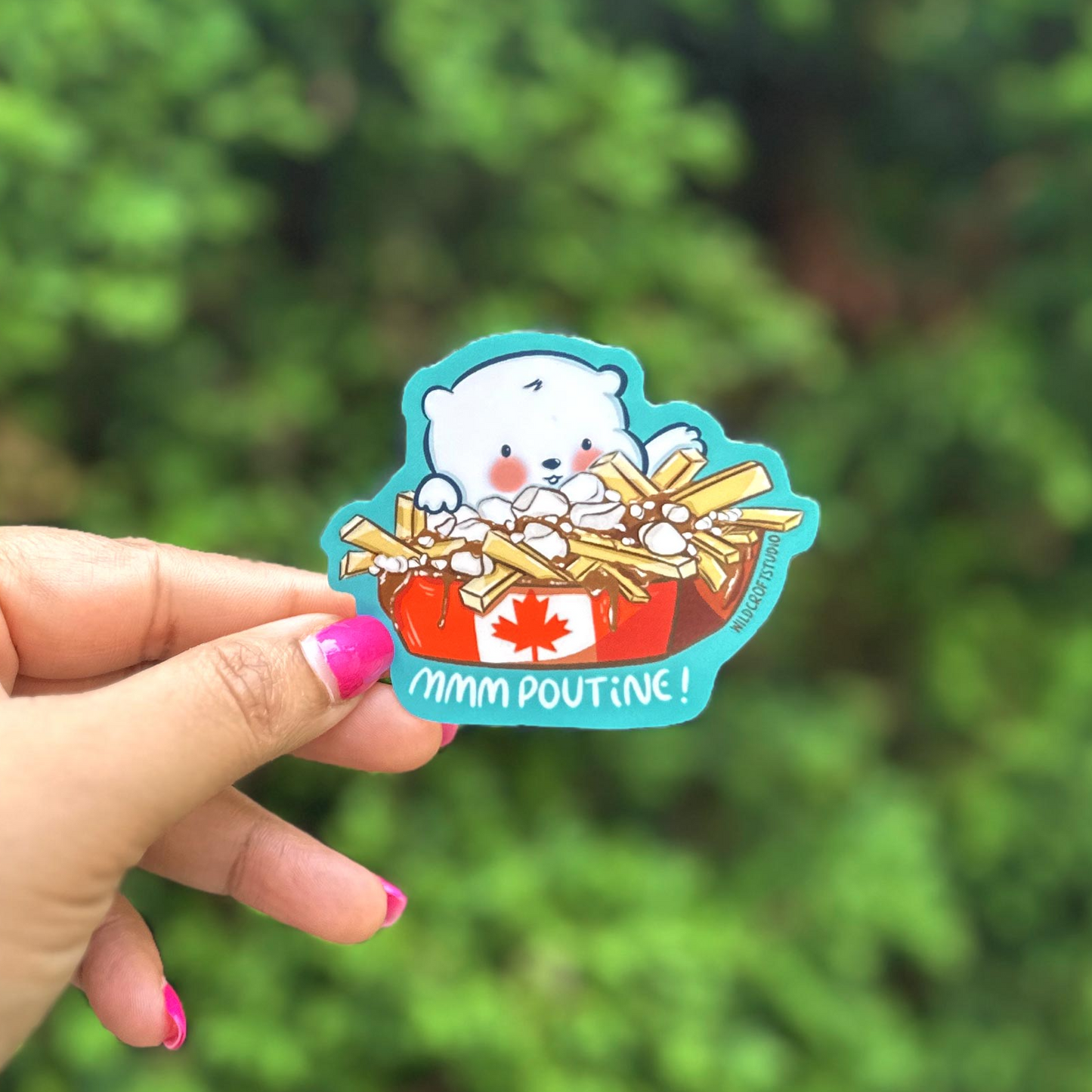 a hand holding a sticker with a picture of a cup of cereal