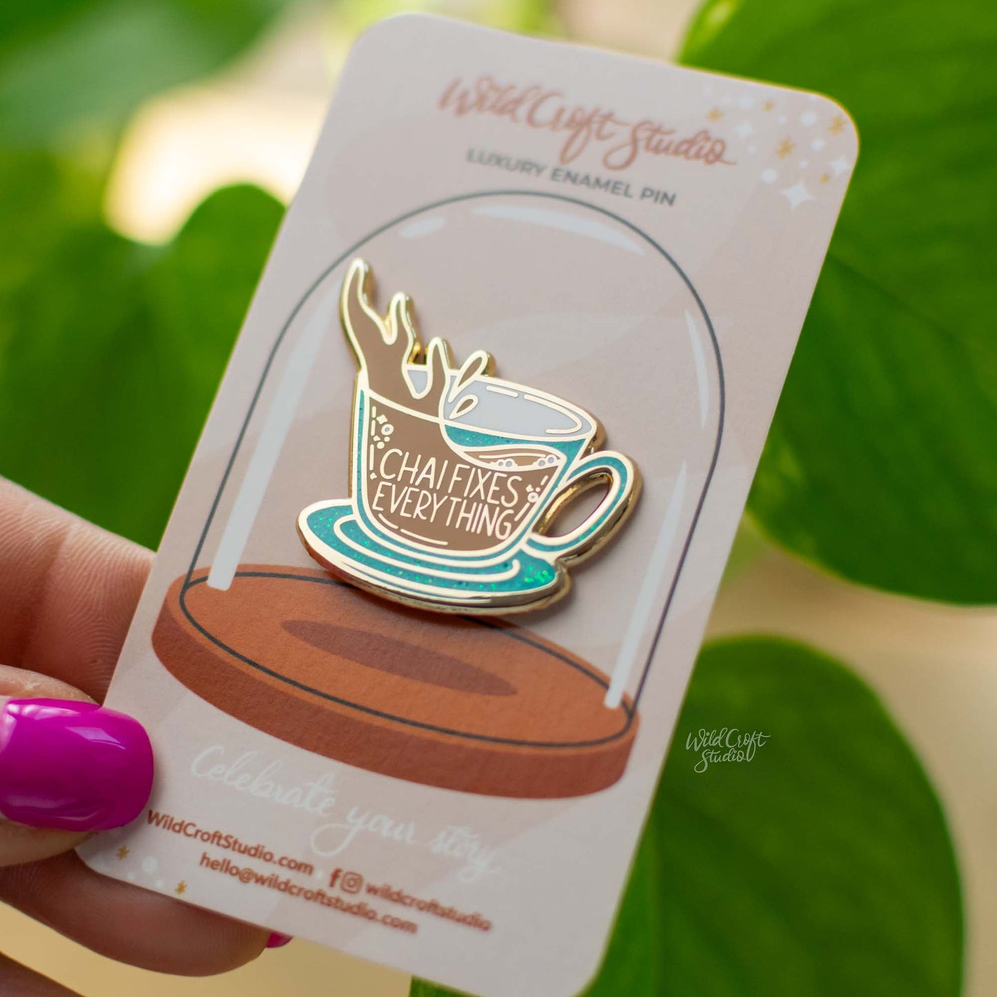 a close up of a person holding a cup of coffee