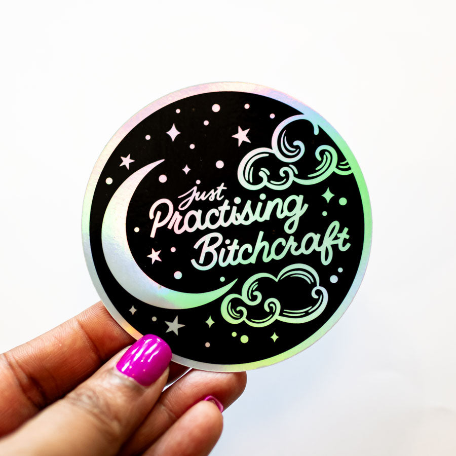 a hand holding a sticker that says just passing birth