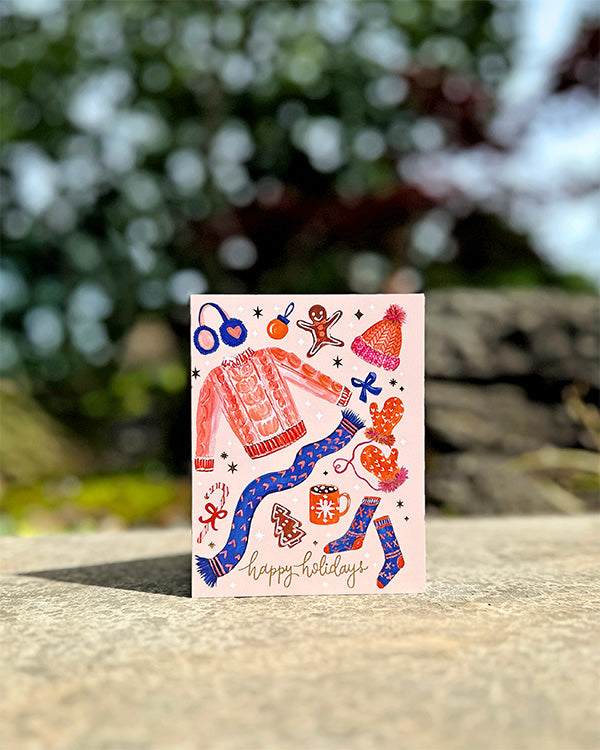 a card with a picture of a woman's dress on it