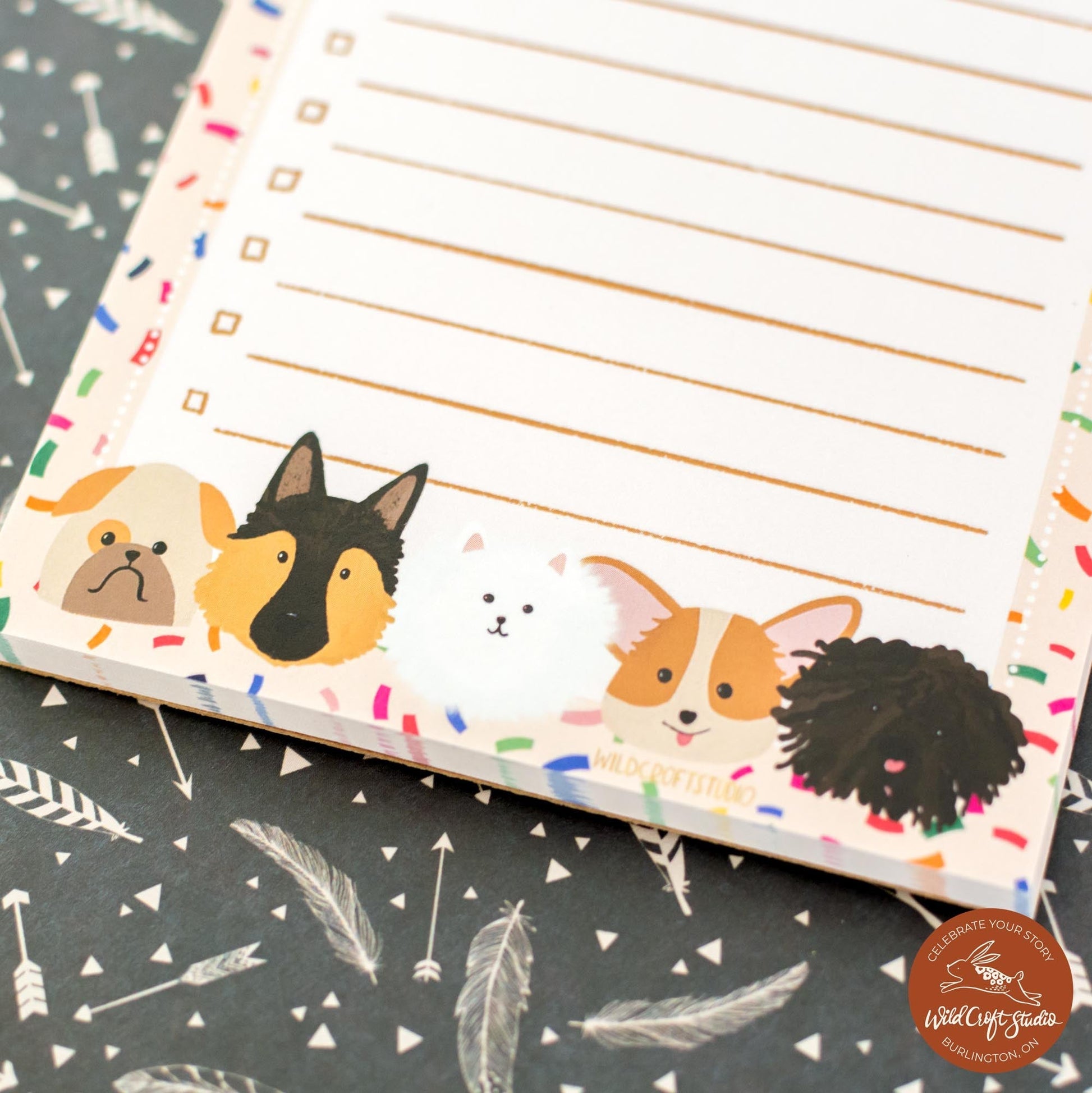 a notepad with a picture of dogs on it
