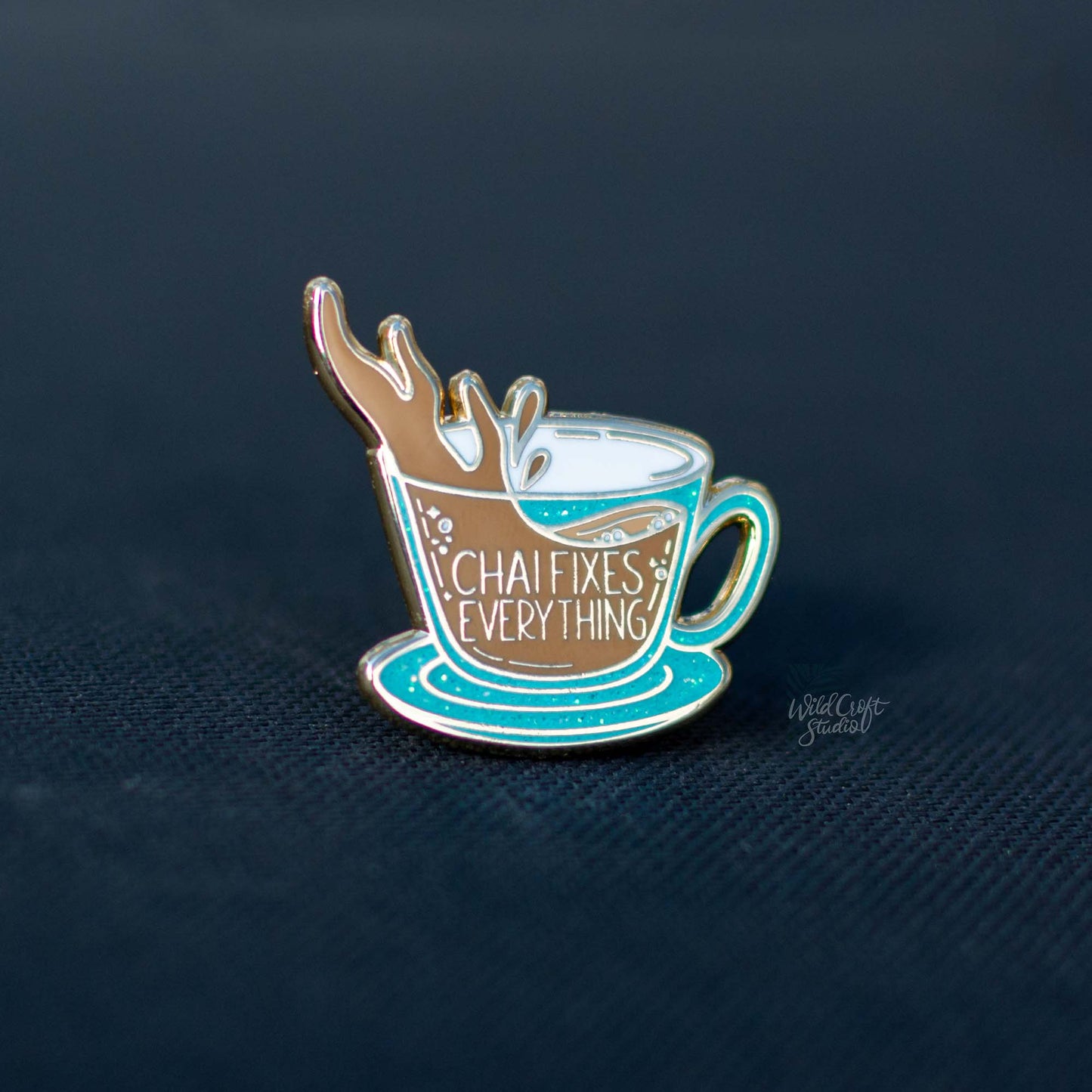 a pin with a cup of coffee on it
