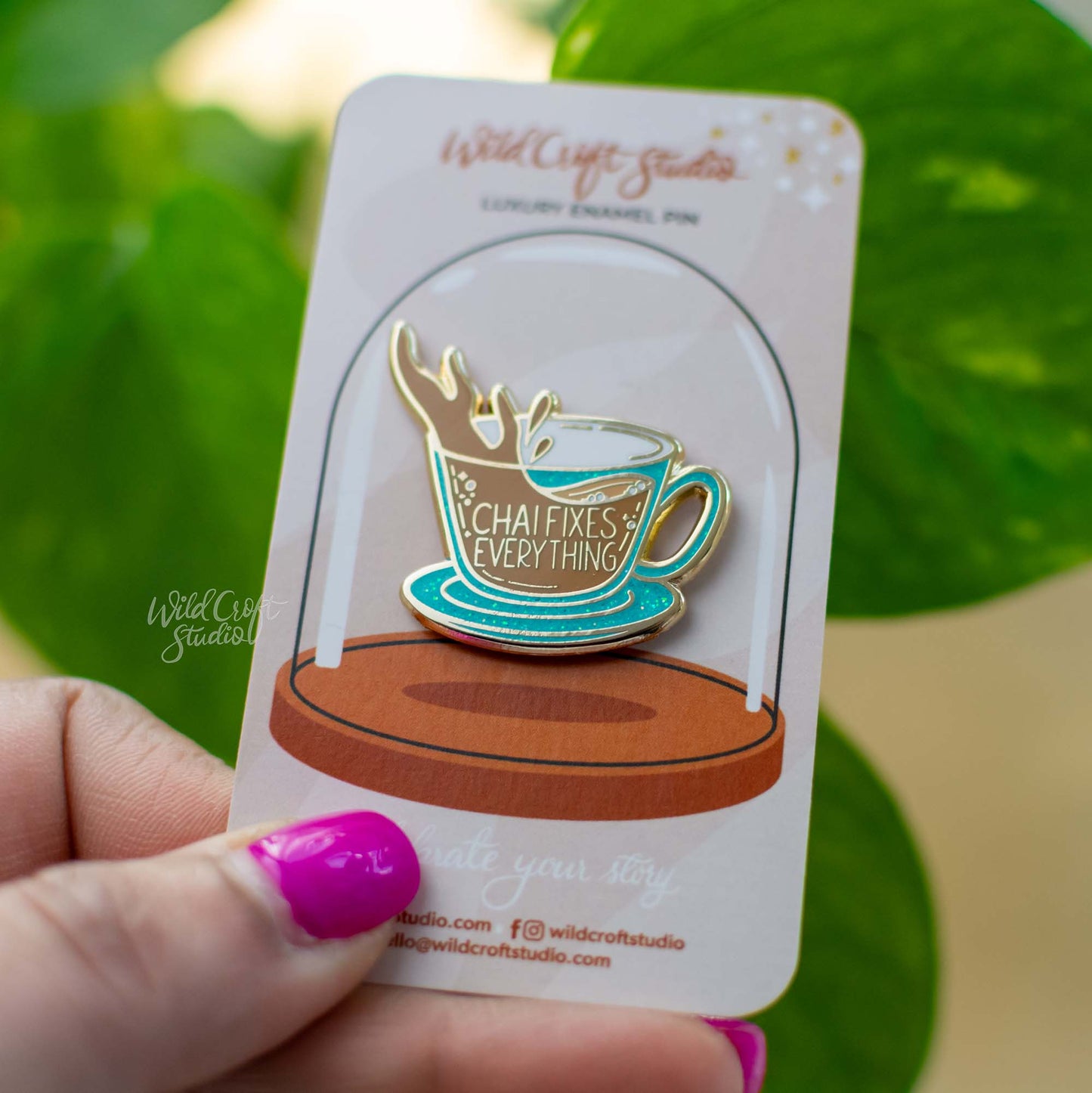 a person holding a card with a coffee cup on it