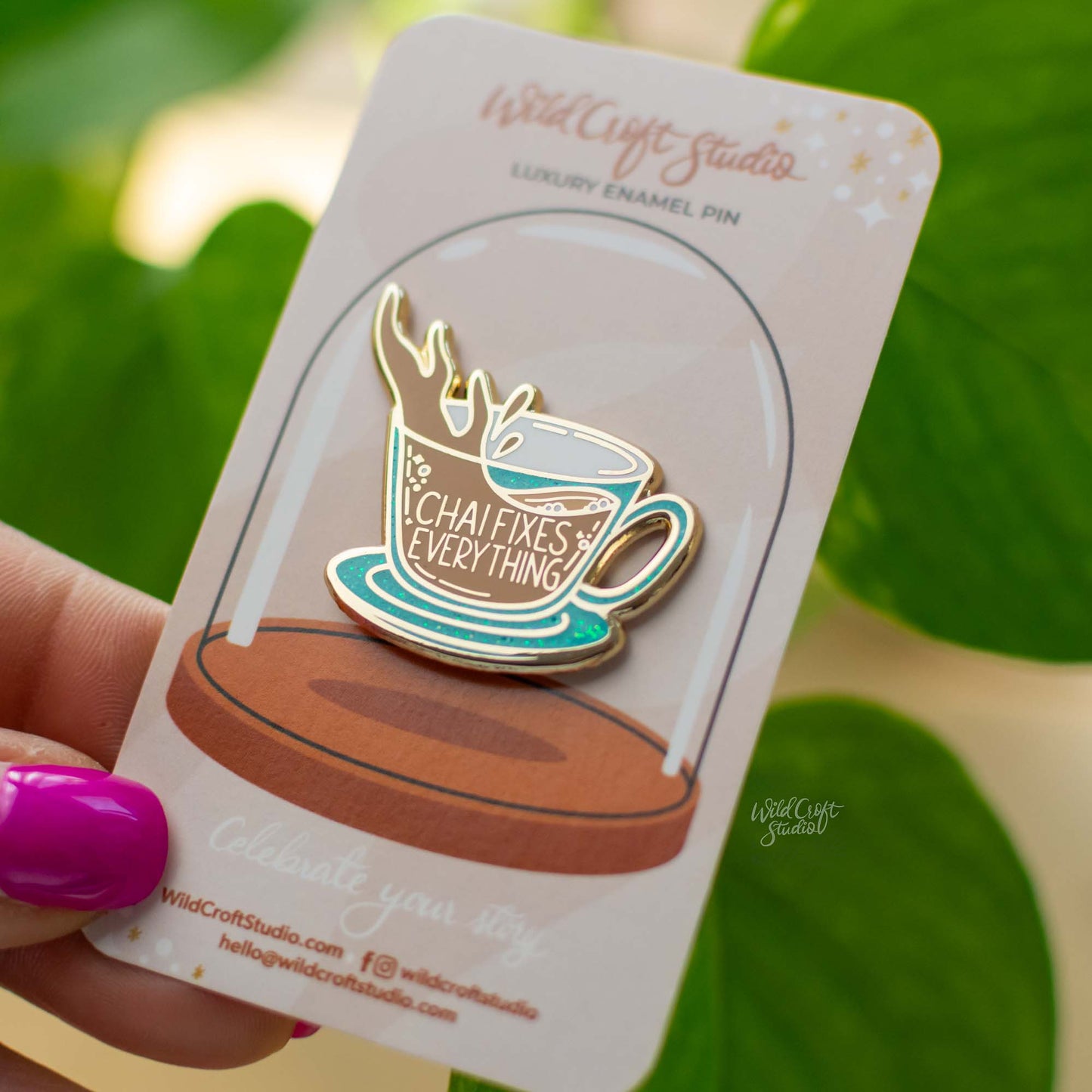 a close up of a person holding a cup of coffee