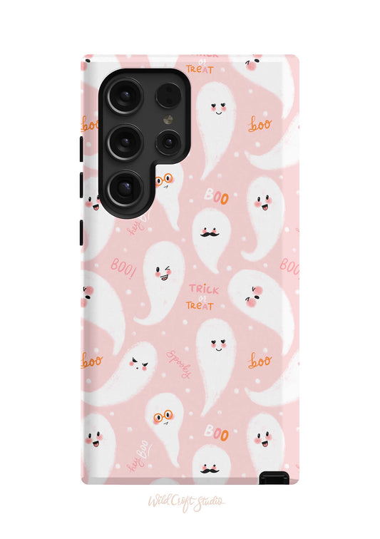 a pink phone case with ghost faces on it