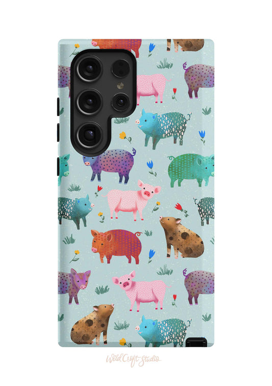 a phone case with pigs on a blue background