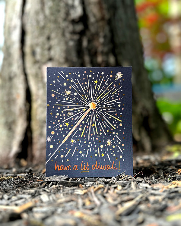 a card with a fireworks design on it