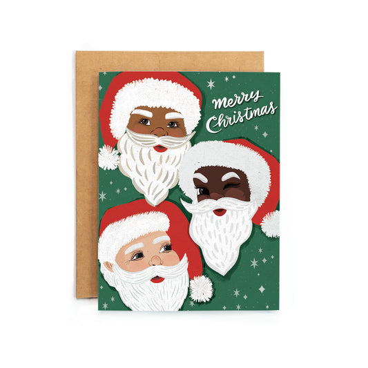 a christmas card with three santas on it