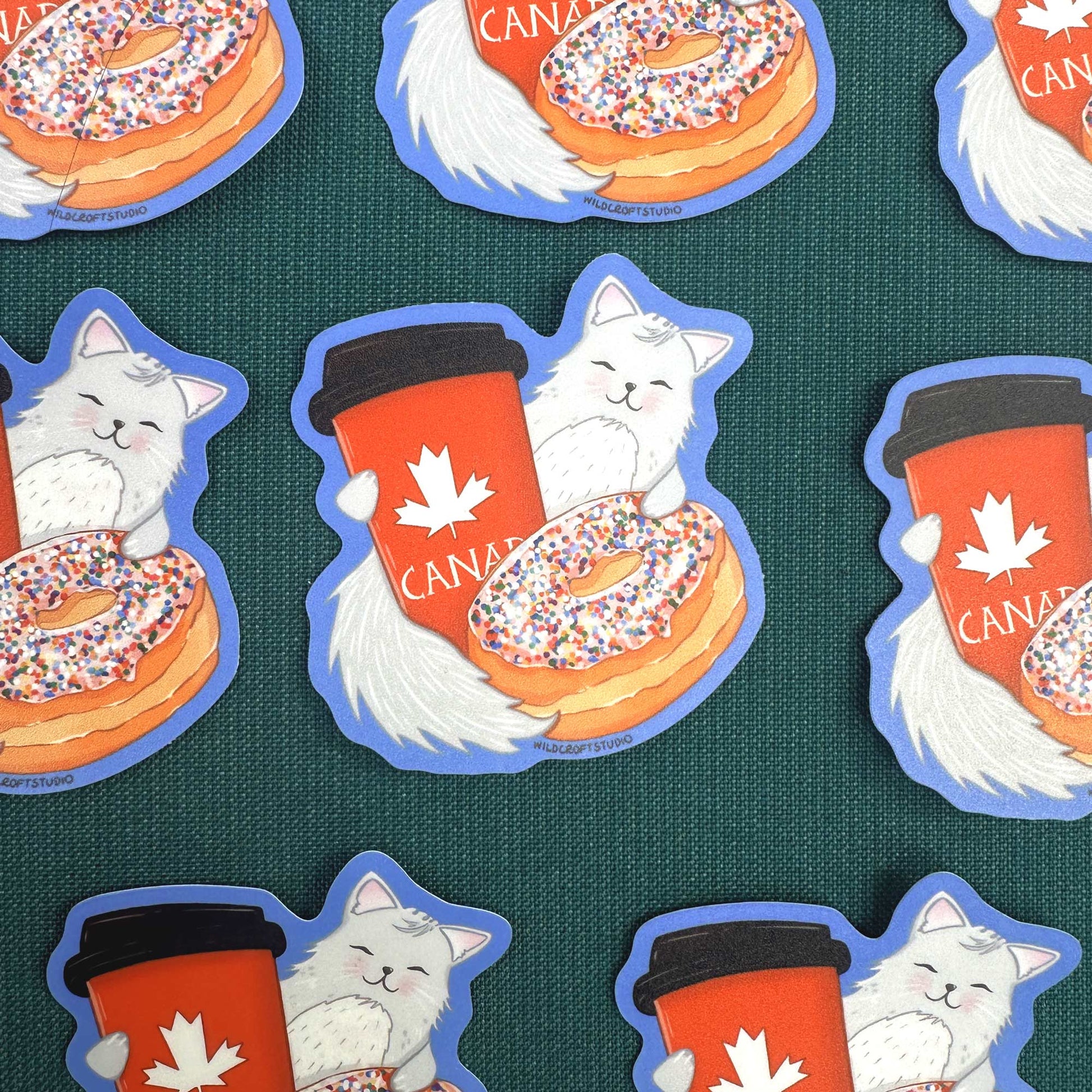 a bunch of stickers with cats and donuts on them