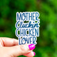 a hand holding a sticker that says mother chicken chicken lover