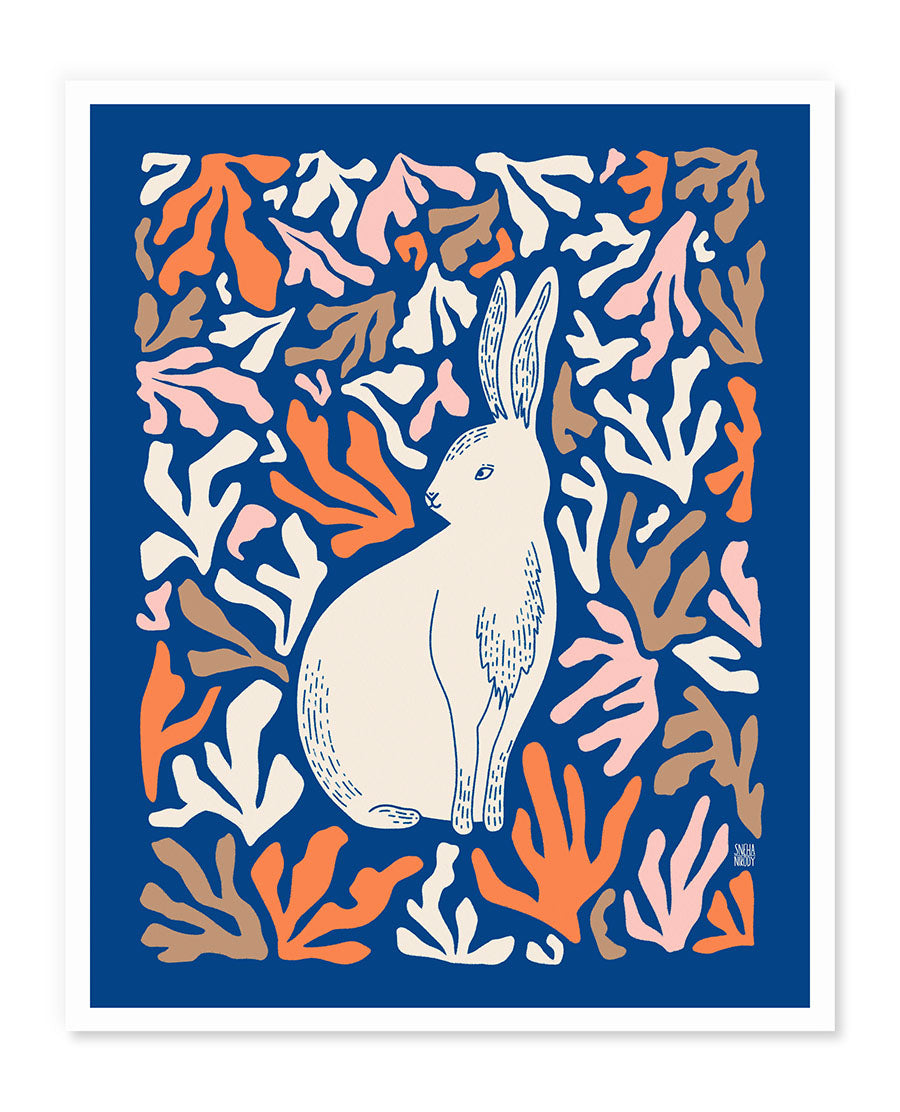 a white rabbit sitting on top of a blue background