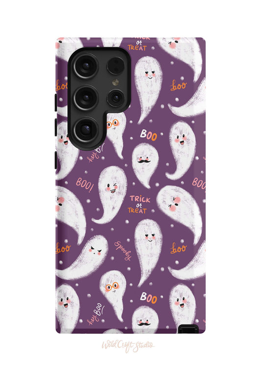 a purple phone case with white ghost faces on it