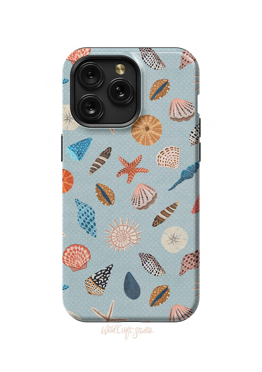 a blue phone case with shells on it