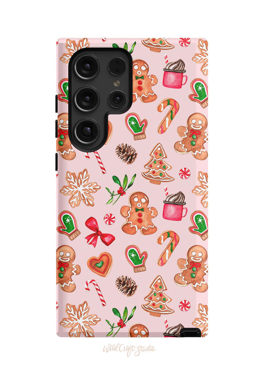 a pink phone case with ginger cookies and candy canes