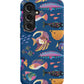 a phone case with colorful fish on a blue background