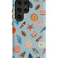 a phone case with shells on a blue background