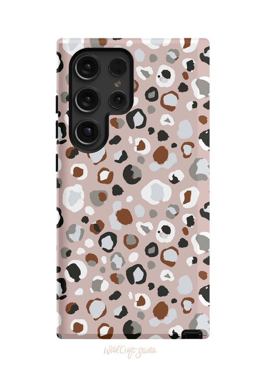 a pink phone case with a leopard print