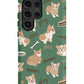 a green phone case with a pattern of corgis