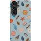 a phone case with shells on a blue background