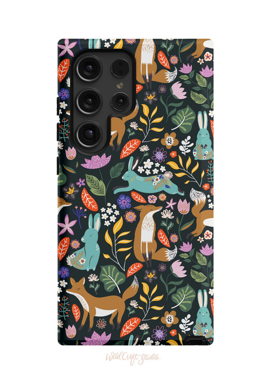 a phone case with a pattern of deer and flowers