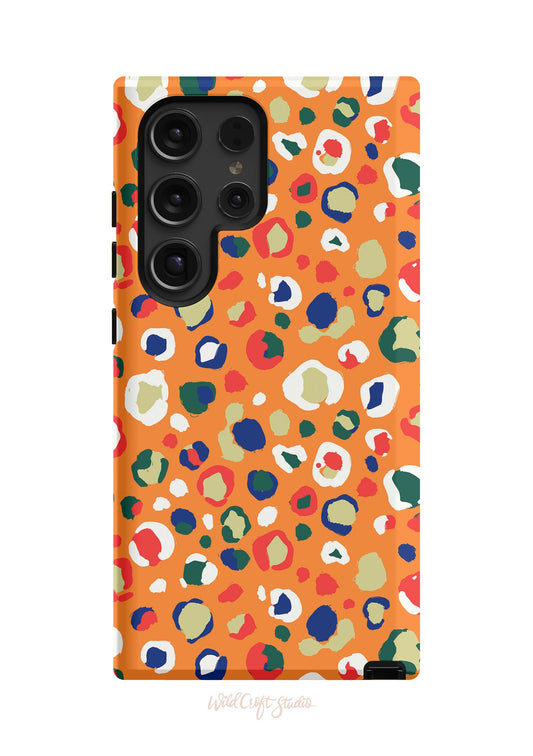 an orange phone case with a colorful pattern