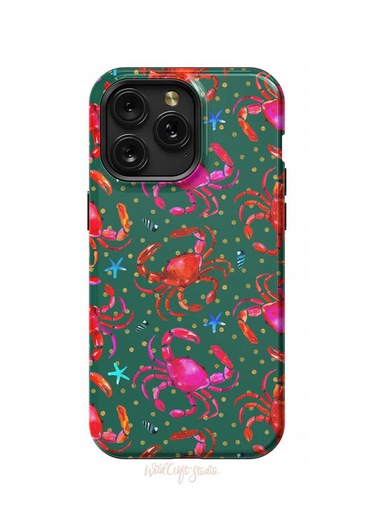 a green phone case with pink crabs on it