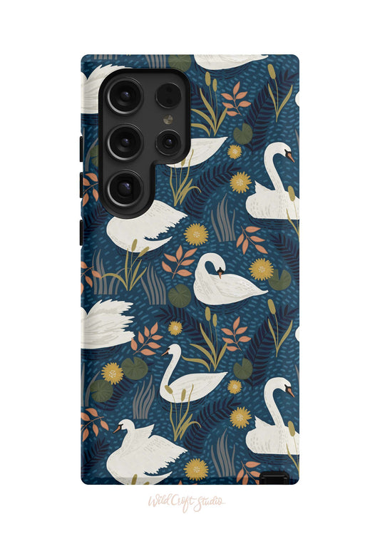 a phone case with swans and flowers on a blue background